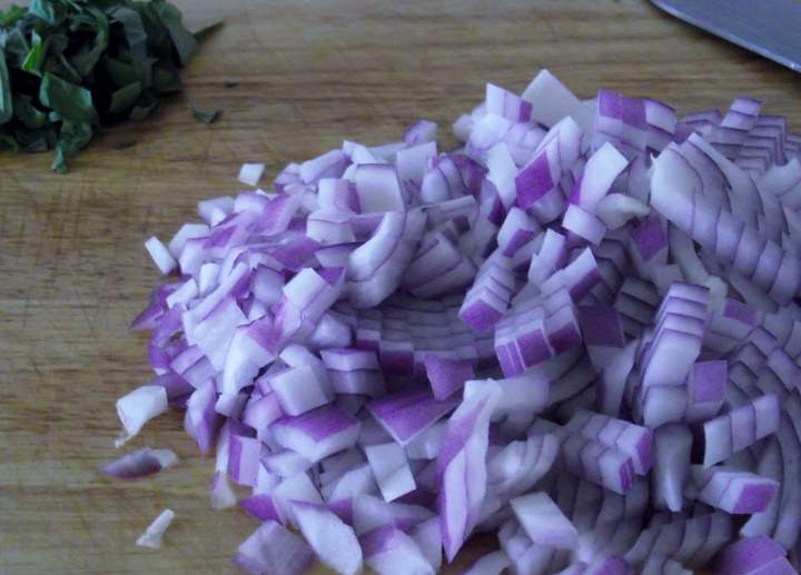 Chopped sweet basil, from one sprig of the basil, and diced onion.