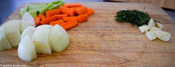 Soffrito or mirepoix, either way it is still the holy trinity of French and Italian cuisine, along with rosemary and garlic on a cutting board.