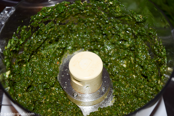 Basil, olive oil, garlic, pine nuts, and salt in a food processor.