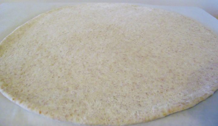 Pizza dough rolled out.