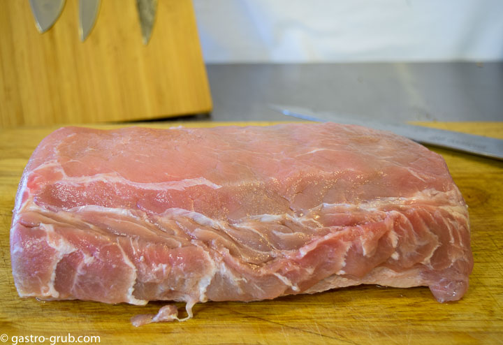 Pork loin on a cutting board.