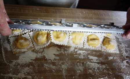 Dumping out ravioli mould.