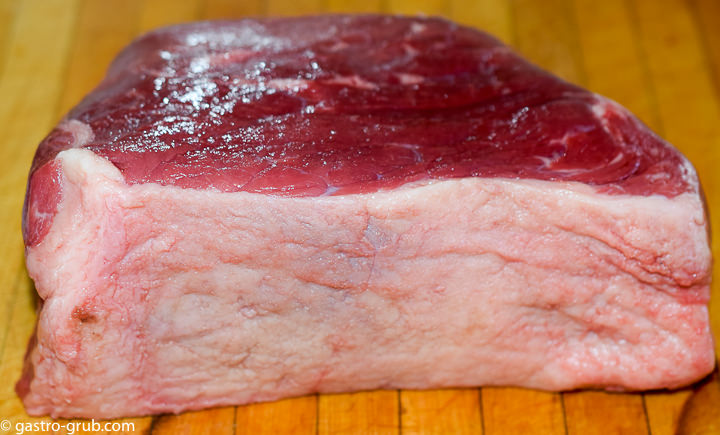 Round roast on a cutting board.