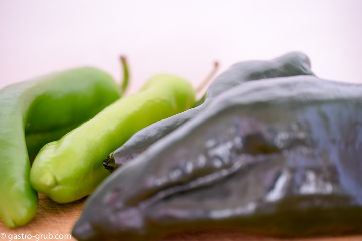 Ingredients for fire roasted peppers: poblano chilies and Anaheim chilies.