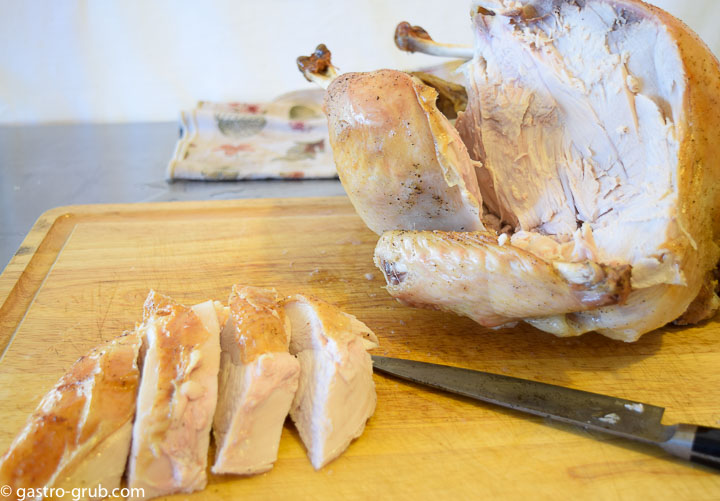 Carving the breast meat from the turkey.