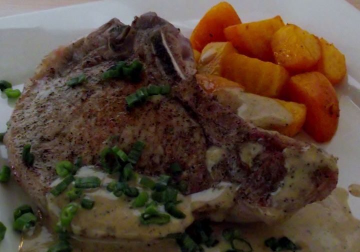 Fried pork chops with a pan sauce and golden beets.