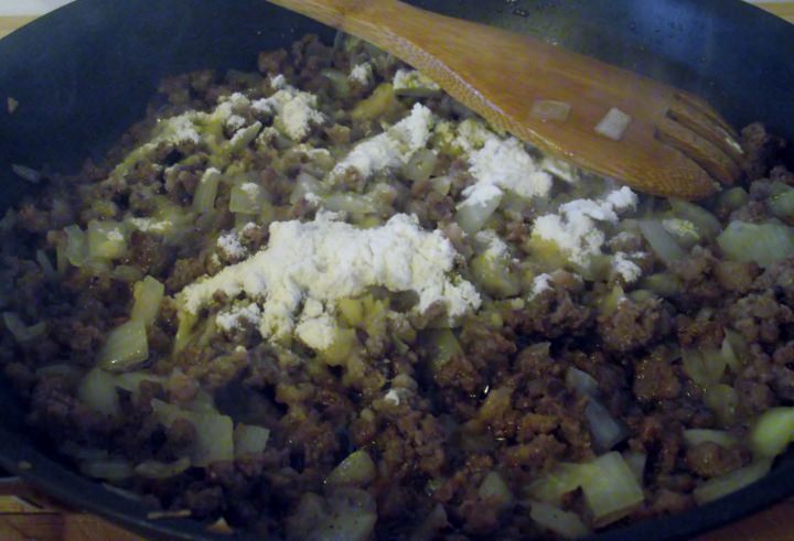 Adding the flour to create a roux.