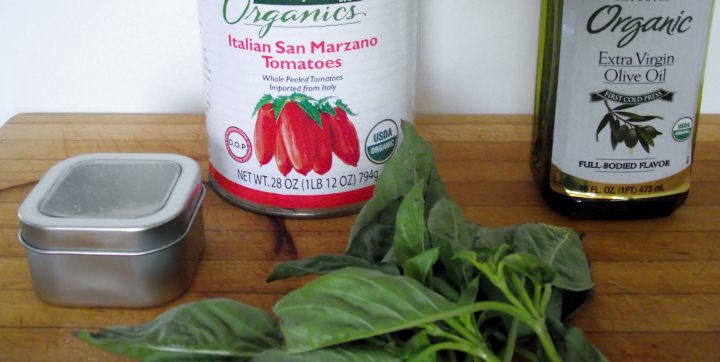 Ingredients for authentic Italian marinara sauce, San Marzano tomatoes, extra virgin olive oil, kosher salt, and sweet basil.