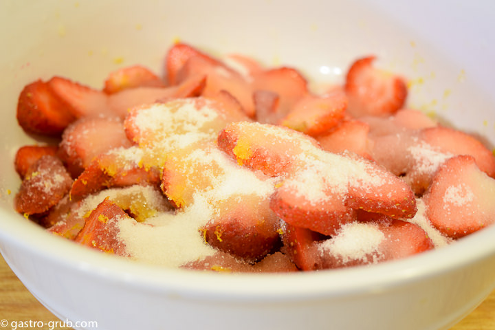 Mixing strawberries for strawberry shortcake.