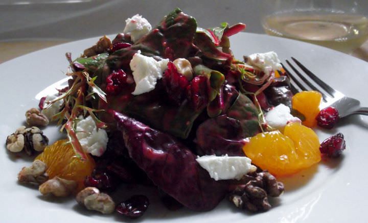 Mix greens with raspberry vinaigrette