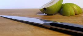 Wusthof chef's knife and a sliced pear.