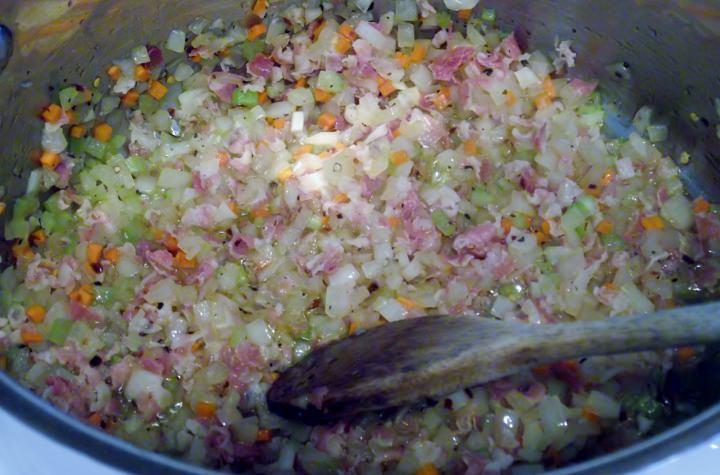Cooking the onion, carrot, and celery with the pancetta.