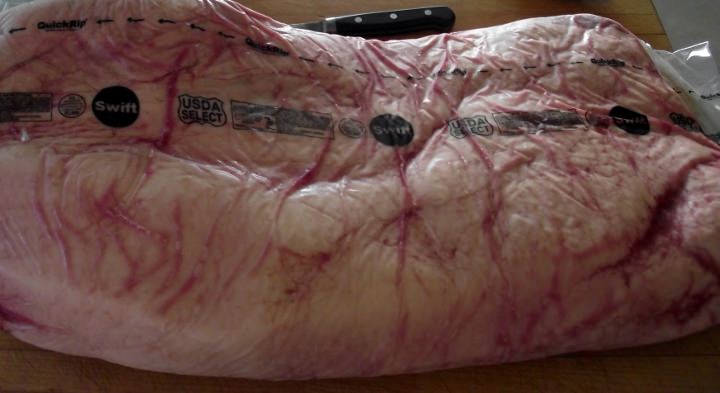 A whole select grade brisket in cryovac. A whole select grade brisket in cryovac.