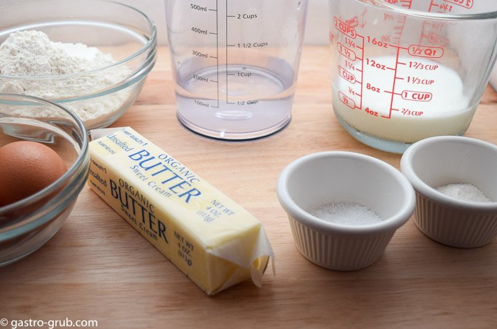 Ingredients for chocolate eclair recipe: eggs, flour, butter, water, milk, salt, and sugar.