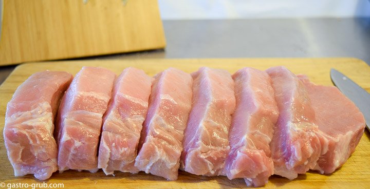 Pork loin sliced into 1-inch pork chops.