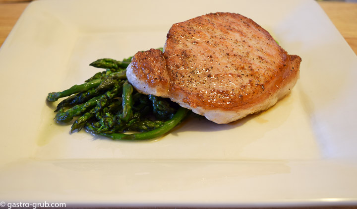 Pork chop and blanched asparagus.